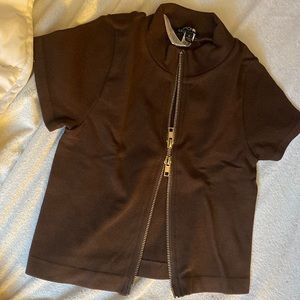 im selling this brown zip up crop top from fashion nova
